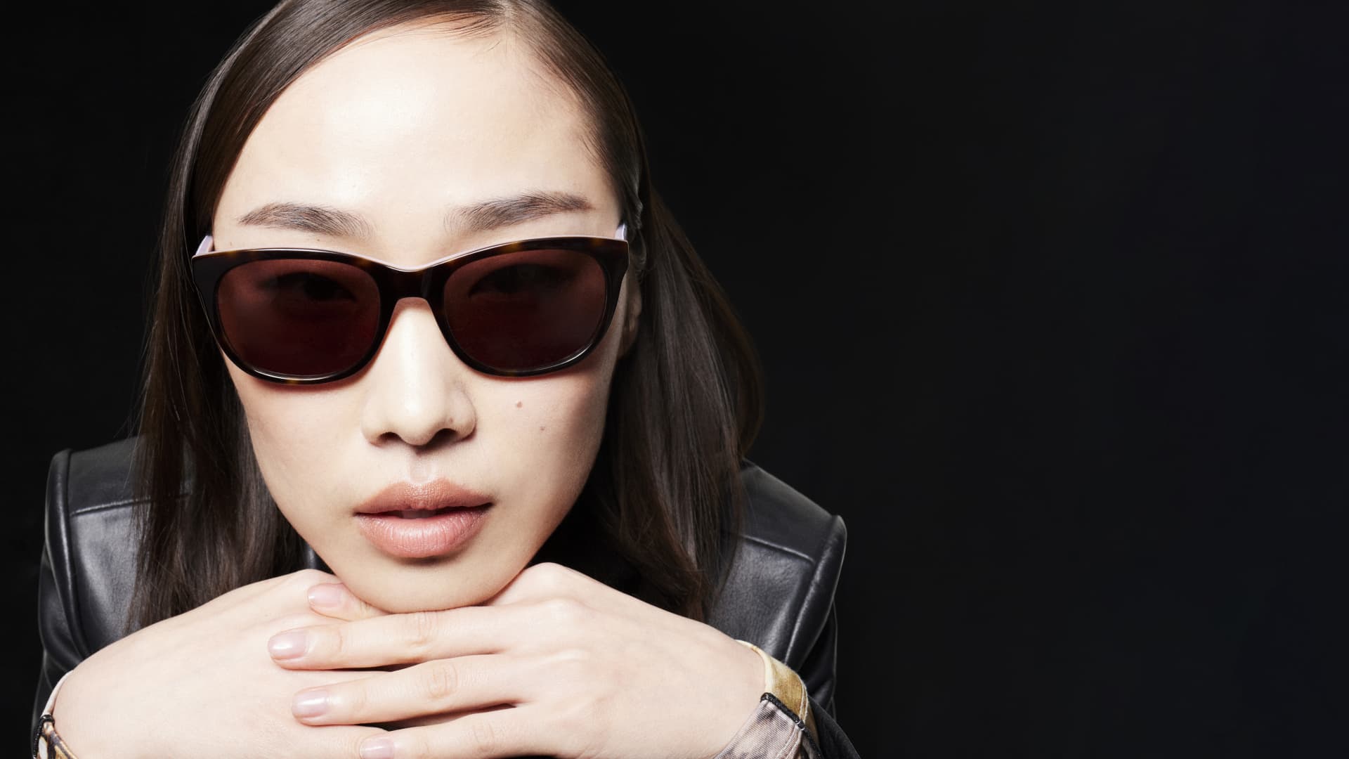 Woman wearing cat eye shaped sunglasses
