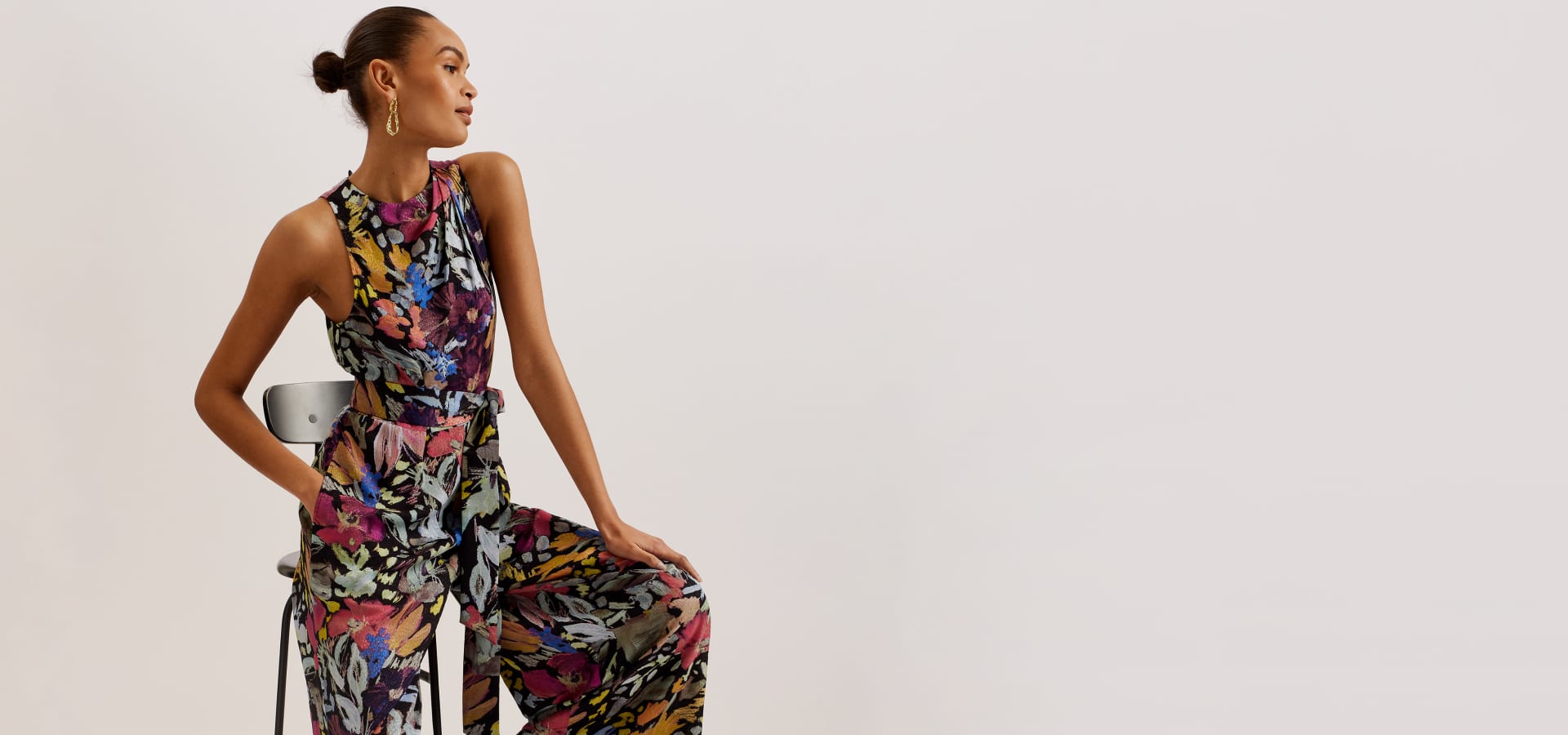 Woman in a floral jumpsuit