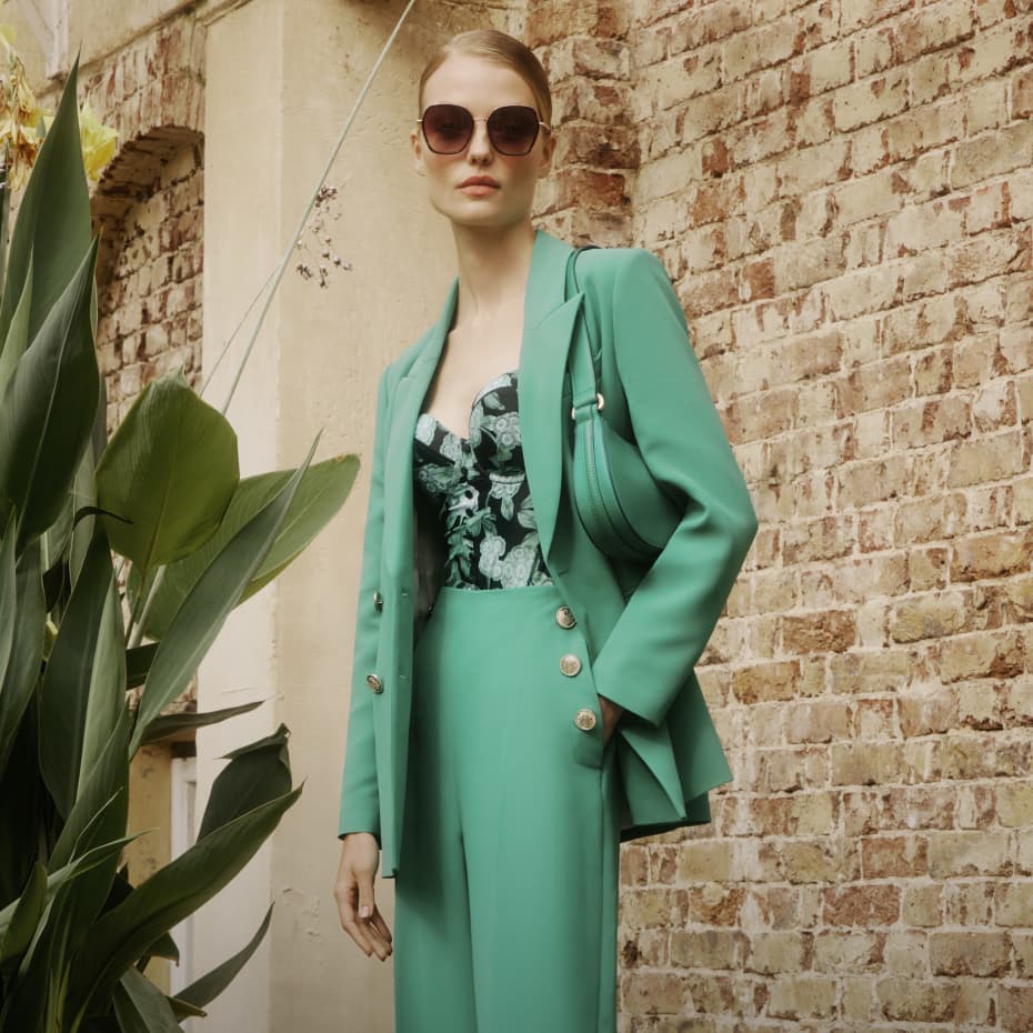 Woman in a green co-ord suit