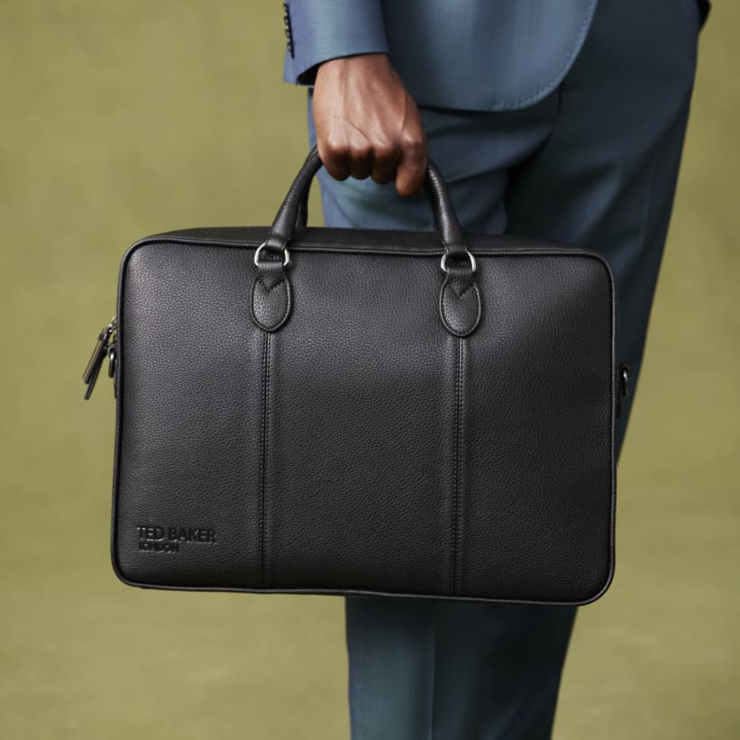 Man carrying leather laptop bag