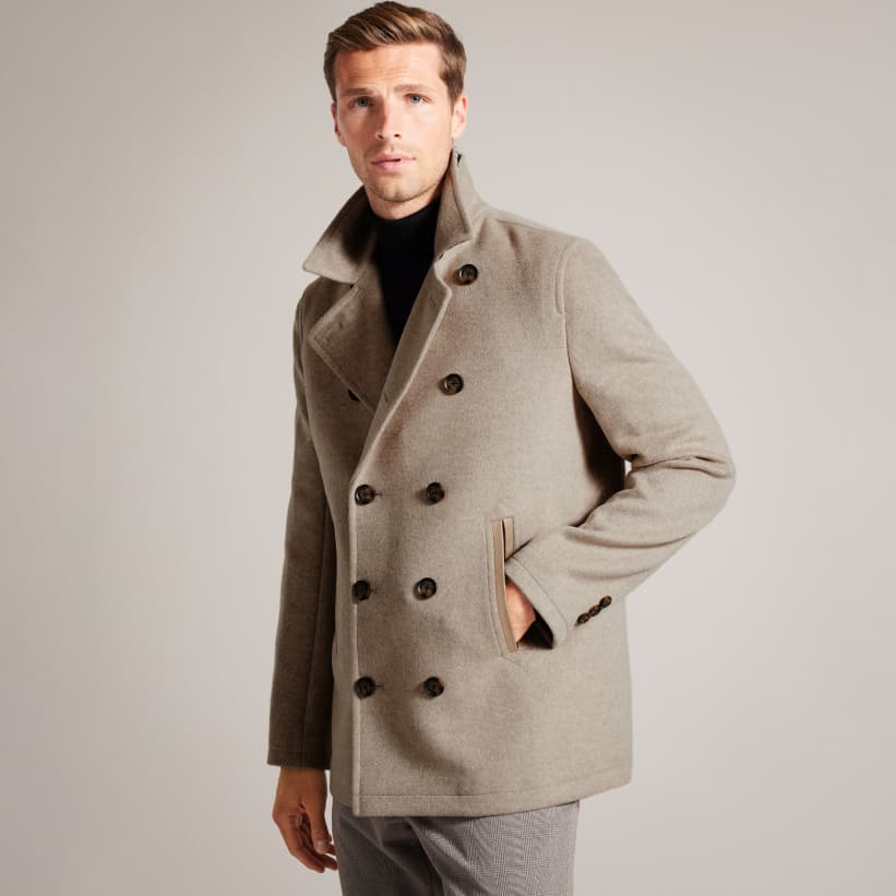 Man in a stone colour peacoat