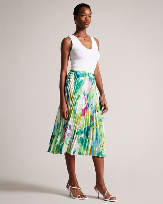 Woman Wearing a Green Painted Floral Pleated Midi Skirt