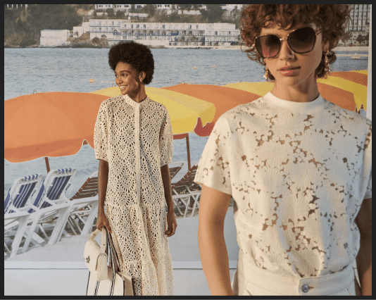 Women in cream embroidered dress and a woman wearing sunglasses and a white floral top
