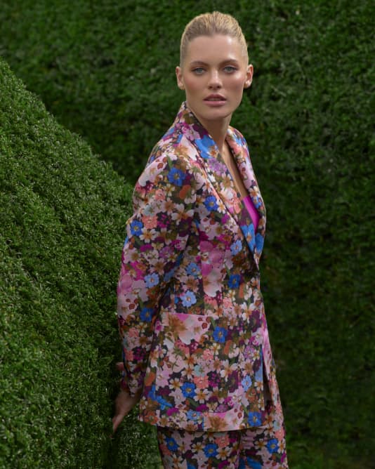Woman in floral suit