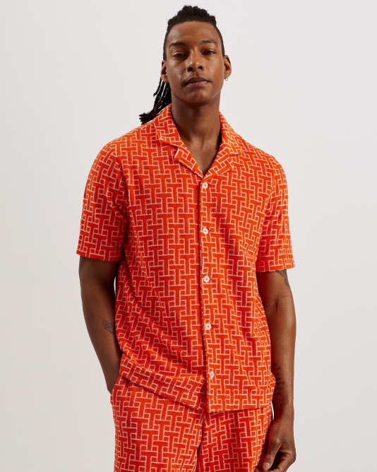 Men in a orange pattern Shirt