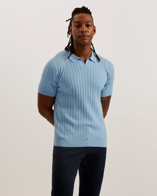 Man in a light blue polo top