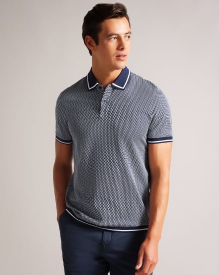 Man in a navy pattern short sleeve polo shirt