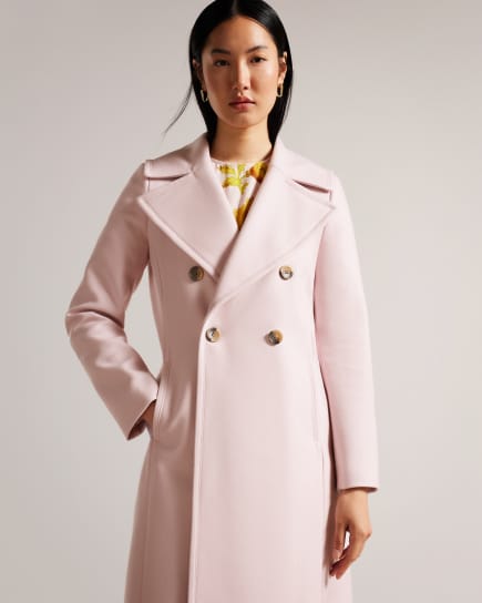 Woman wearing a pink coat