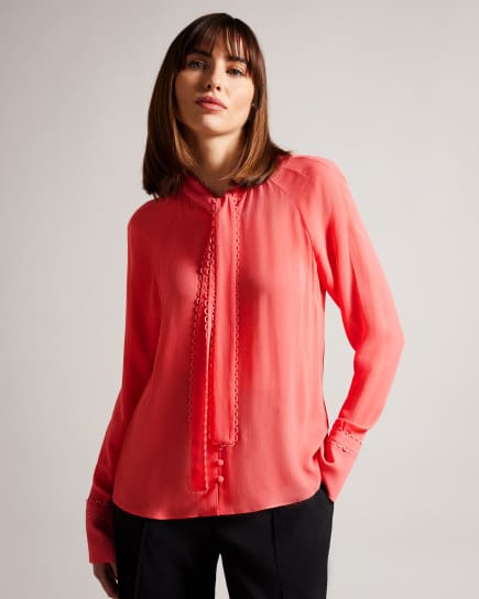Woman in coral top