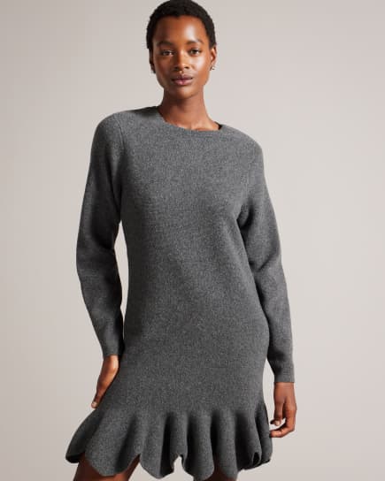 Woman in grey knitted dress
