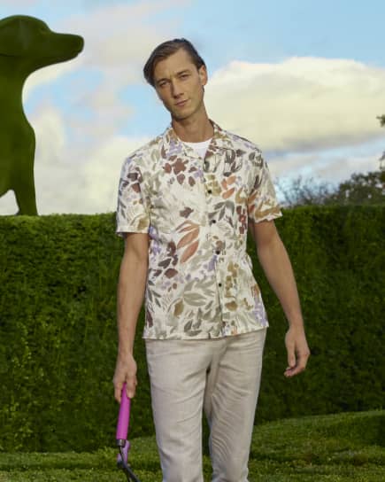 Man in a floral printed short sleeve shirt