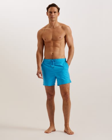 Man in blue swim shorts