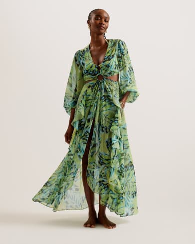 Woman in floral print green cover up