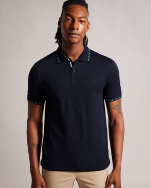 Man in navy polo shirt with check collar