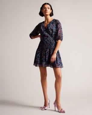 Woman in a Floral Smock Panel Wrap Mini Dress
