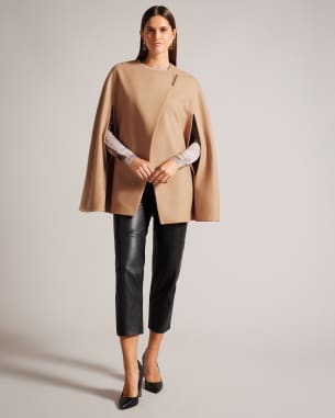 Woman in tan cape coat