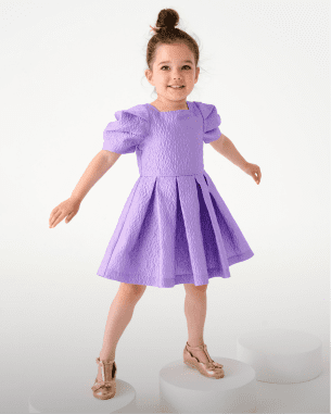 Younger girl in a lilac dress