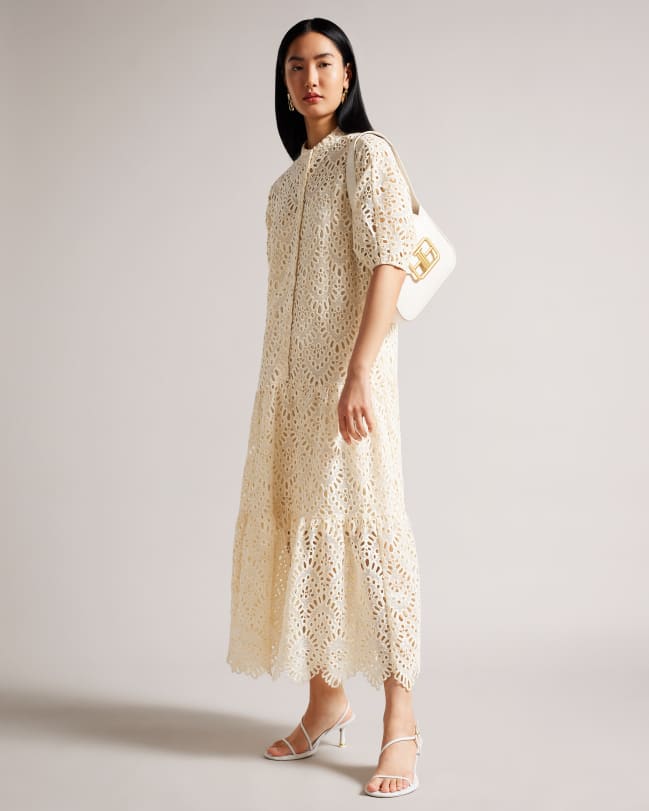 Woman wearing an oversized lace shirt dress With Puff Sleeve