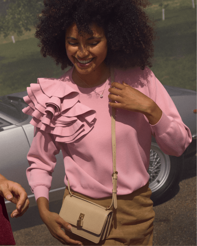 Woman in a pink long sleeve top
